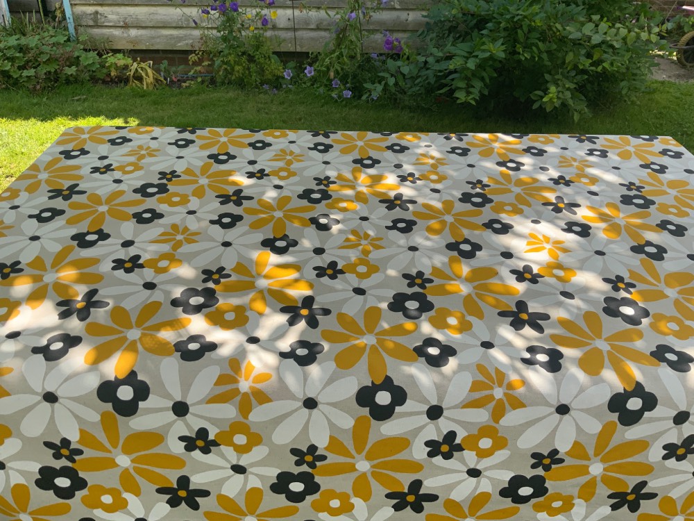 Hippy Flowers French Oilcloth in Yellow